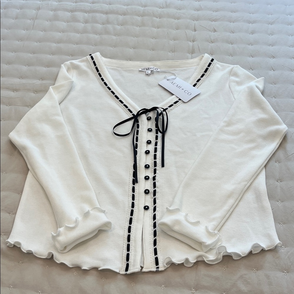 Elegant White Button-Up Blouse with Black Trim